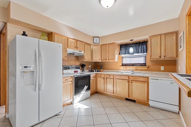 kitchen featuring under cabinet range hood, white appliances, and light brown cabinetry