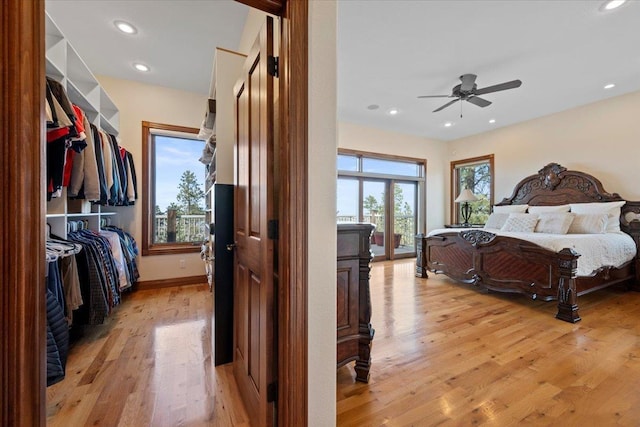 bedroom with recessed lighting, a ceiling fan, light wood-type flooring, and baseboards