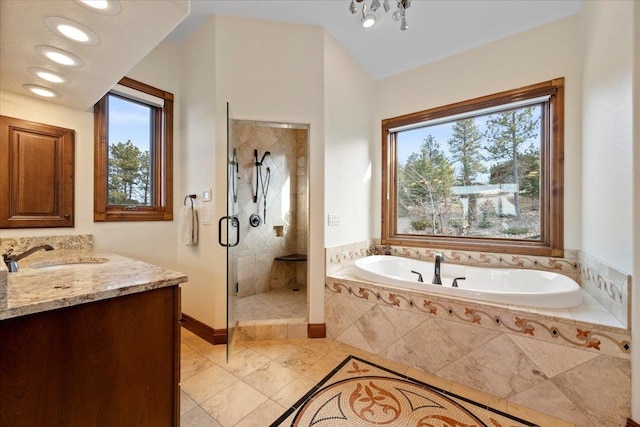 bathroom featuring a garden tub, recessed lighting, a shower stall, baseboards, and vanity