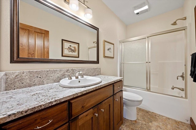 full bathroom with vanity, toilet, and enclosed tub / shower combo