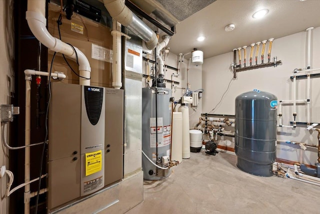 utility room featuring water heater