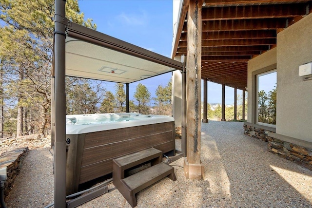 view of patio / terrace with a hot tub