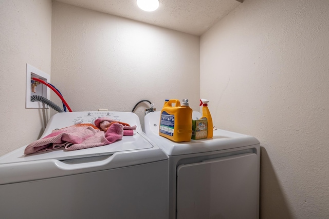 621 Other, Rapid City, SD 57701 - clothes washing area with washing machine and clothes dryer, laundry area, and a textured wall