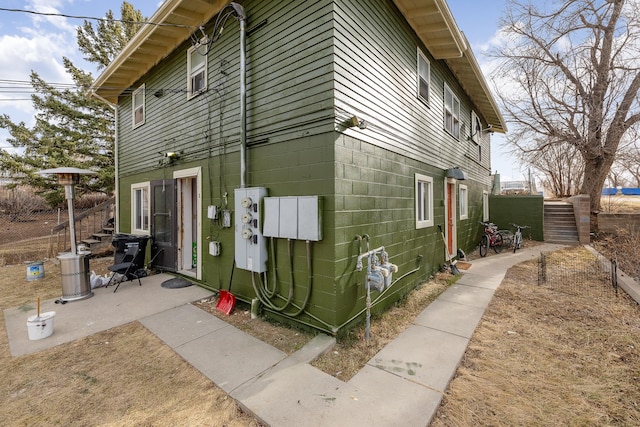 621 Other, Rapid City, SD 57701 - view of side of home featuring concrete block siding and fence