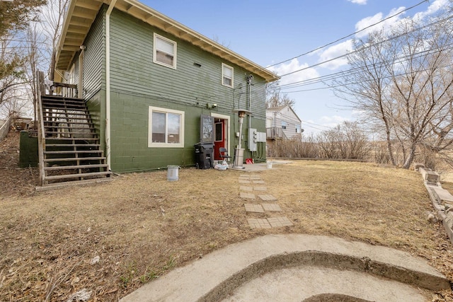 621 Other, Rapid City, SD 57701 - rear view of property featuring concrete block siding and stairs