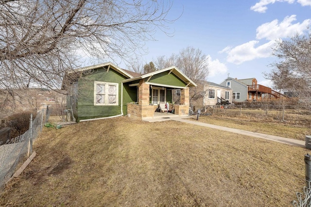 621 Other, Rapid City, SD 57701 - view of front facade featuring a porch, fence, and a front yard