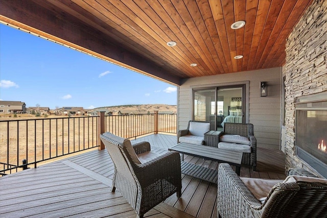 wooden deck featuring an outdoor hangout area