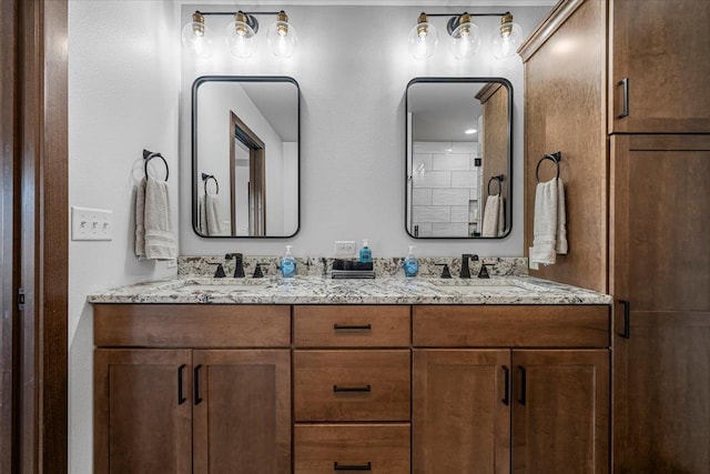 bathroom featuring double vanity and a sink