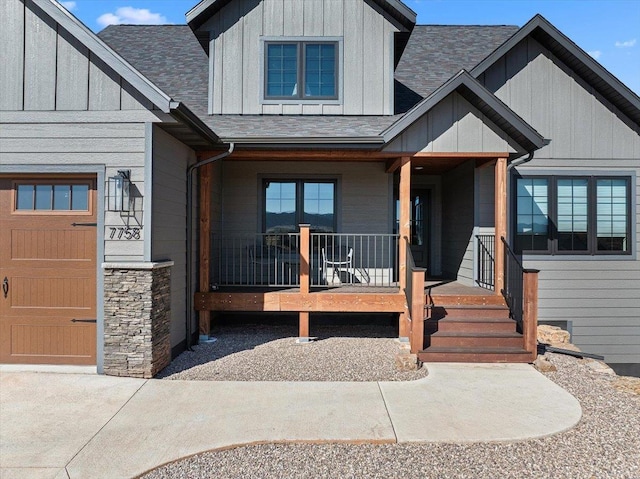 view of front of house featuring a porch, board and batten siding, and a shingled roof