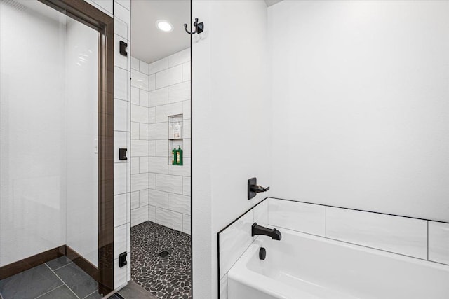 full bath featuring tile patterned floors