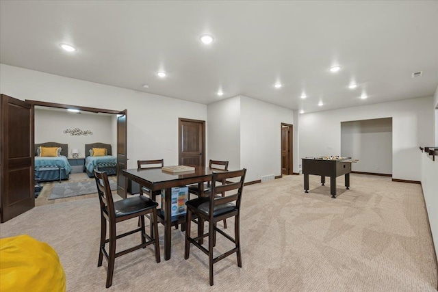 dining space with recessed lighting, visible vents, baseboards, and light colored carpet