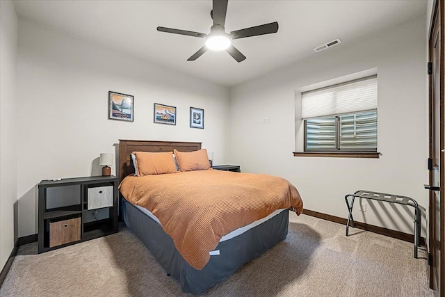 bedroom featuring visible vents, baseboards, carpet, and ceiling fan