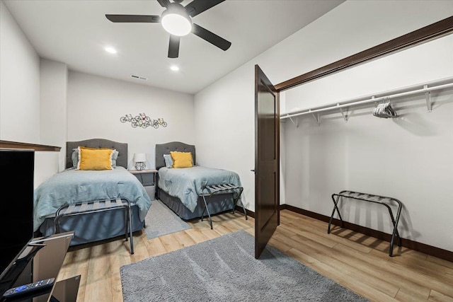 bedroom featuring visible vents, a ceiling fan, wood finished floors, recessed lighting, and baseboards