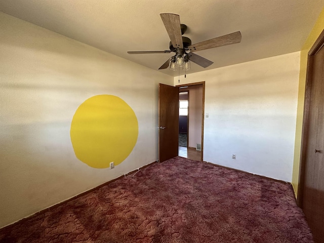 unfurnished bedroom with carpet flooring and a ceiling fan