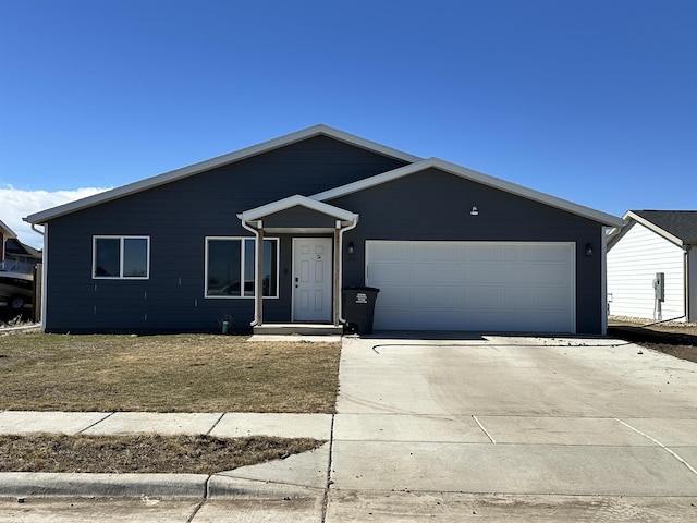 ranch-style house with an attached garage and driveway