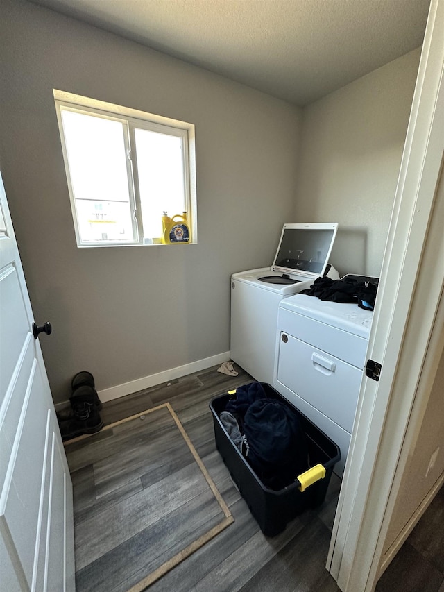 laundry room featuring baseboards, washer and clothes dryer, laundry area, a textured ceiling, and dark wood-style flooring