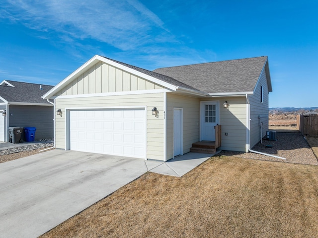 427 Diamond Ridge Blvd, Rapid City, SD 57703 - single story home featuring fence, driveway, a shingled roof, a garage, and board and batten siding