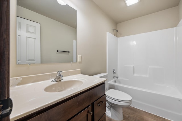 427 Diamond Ridge Blvd, Rapid City, SD 57703 - bathroom featuring tub / shower combination, toilet, vanity, and wood finished floors