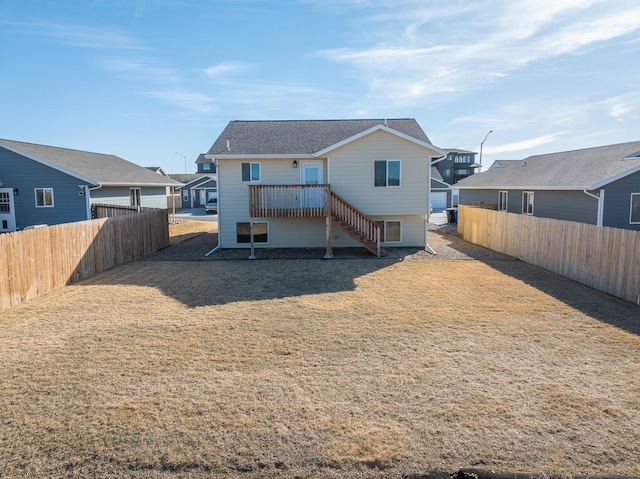 427 Diamond Ridge Blvd, Rapid City, SD 57703 - back of property featuring stairs, a fenced backyard, a lawn, and roof with shingles