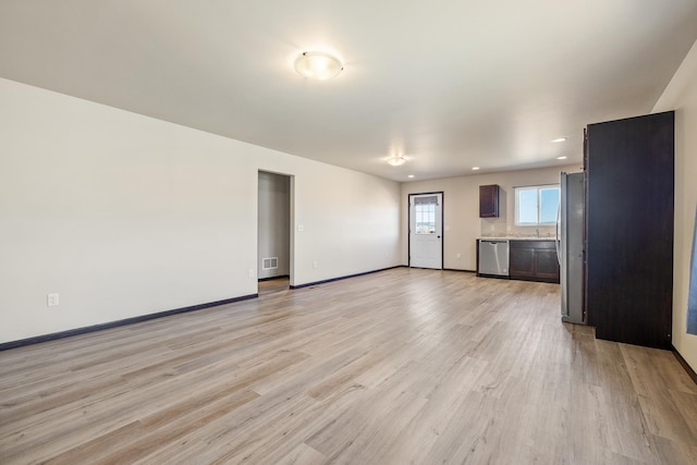 427 Diamond Ridge Blvd, Rapid City, SD 57703 - unfurnished living room with recessed lighting, light wood-type flooring, baseboards, and visible vents