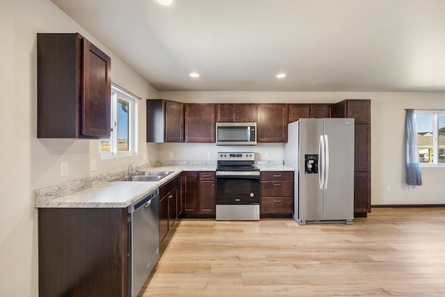427 Diamond Ridge Blvd, Rapid City, SD 57703 - kitchen featuring a sink, appliances with stainless steel finishes, light countertops, and dark brown cabinets
