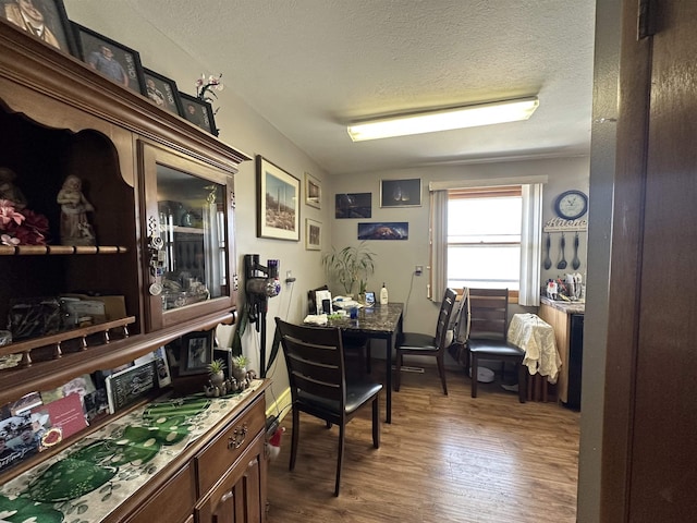 109 David Dr, Sturgis, SD 57785 - dining room featuring wood finished floors and a textured ceiling