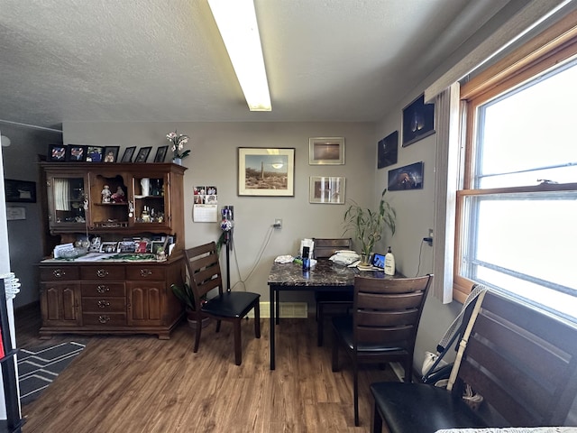 109 David Dr, Sturgis, SD 57785 - office area featuring a textured ceiling, baseboards, and wood finished floors