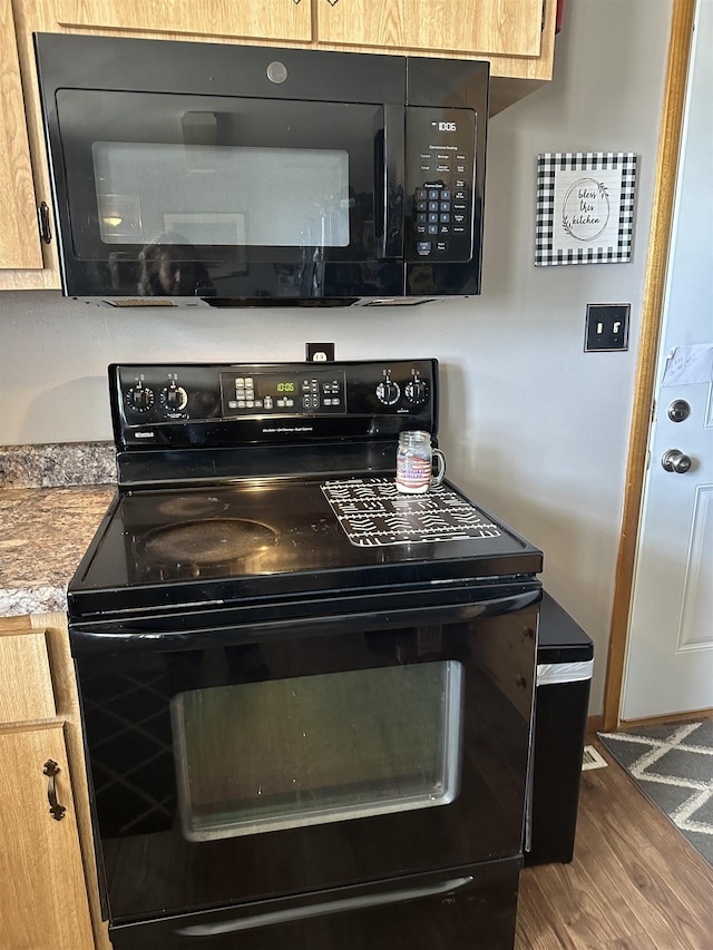 109 David Dr, Sturgis, SD 57785 - kitchen with black appliances and wood finished floors