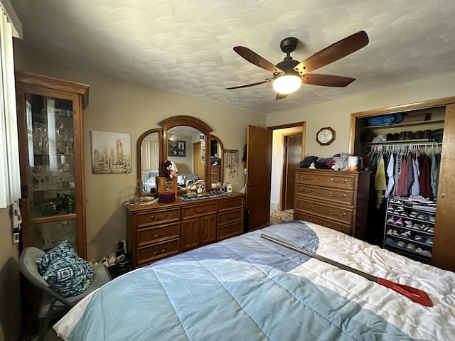 109 David Dr, Sturgis, SD 57785 - bedroom featuring a closet, a textured ceiling, and ceiling fan