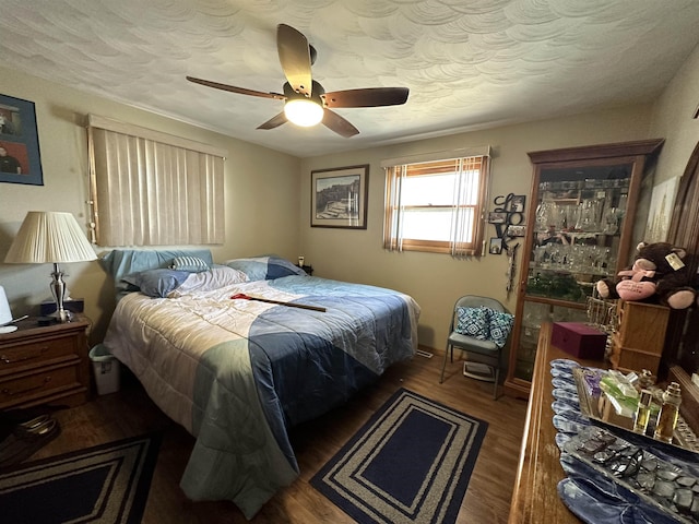 109 David Dr, Sturgis, SD 57785 - bedroom featuring a textured ceiling, wood finished floors, and a ceiling fan