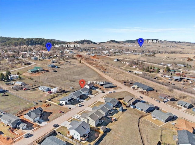 drone / aerial view featuring a mountain view and a residential view