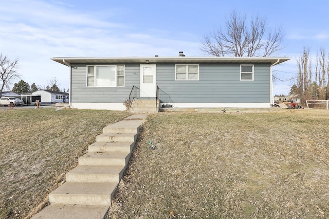 view of front of property with a front lawn