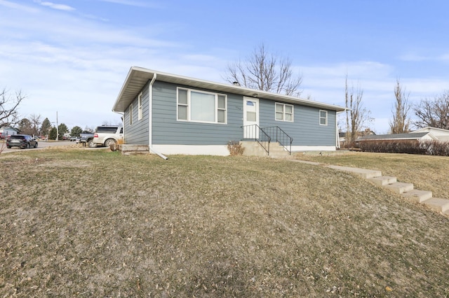 view of front of home with a front lawn
