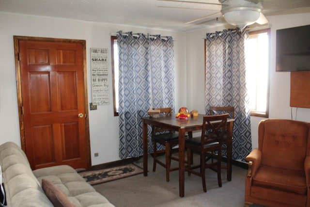 dining room featuring ceiling fan and carpet flooring