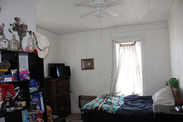bedroom featuring a decorative wall and crown molding