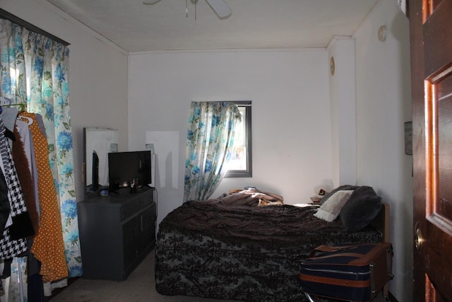carpeted bedroom with a ceiling fan