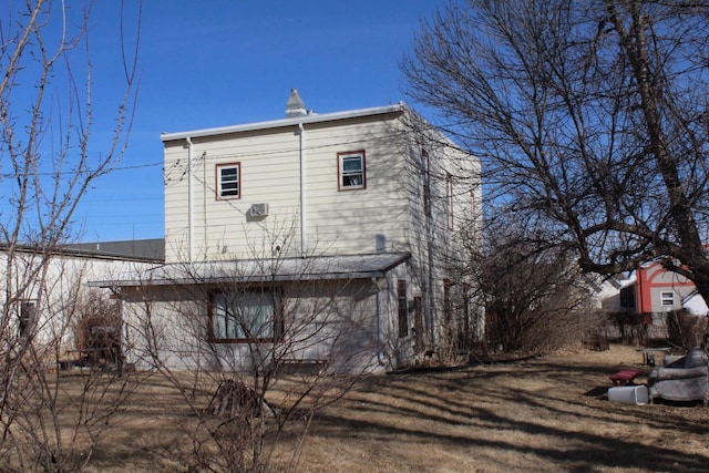 view of property exterior with a yard