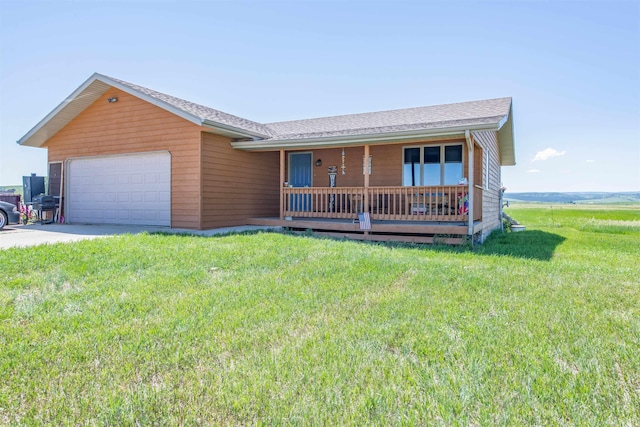 13220 N Haines Ave, Rapid City, SD 57701 - ranch-style house featuring a front yard, covered porch, an attached garage, and concrete driveway