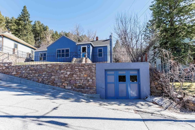 41 Taylor Ave, Deadwood, SD 57732 - view of front of house featuring stucco siding and a fenced front yard