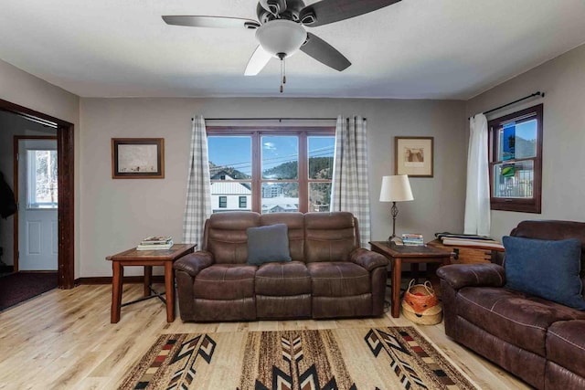 41 Taylor Ave, Deadwood, SD 57732 - living room with baseboards, light wood-style flooring, and ceiling fan