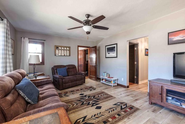 41 Taylor Ave, Deadwood, SD 57732 - living area featuring baseboards, ceiling fan, and light wood-style floors