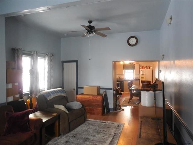 23508 Main St, Caputa, SD 57725 - living area featuring a ceiling fan, a towering ceiling, and wood finished floors