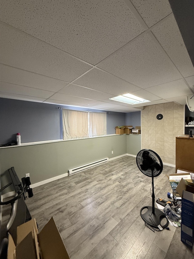 4809 Meadow Dr, Black Hawk, SD 57718 - workout area with baseboards, wood finished floors, a baseboard heating unit, and a drop ceiling