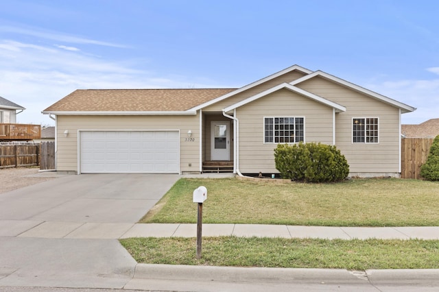 3370 Remington Rd, Rapid City, SD 57703 - single story home with a garage, a front lawn, concrete driveway, and fence