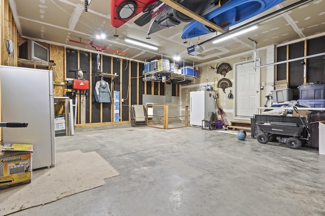 3370 Remington Rd, Rapid City, SD 57703 - garage with a garage door opener and freestanding refrigerator