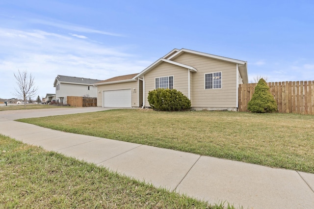 3370 Remington Rd, Rapid City, SD 57703 - single story home with concrete driveway, a garage, fence, and a front lawn