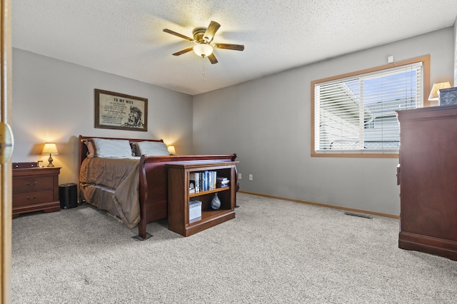 3370 Remington Rd, Rapid City, SD 57703 - carpeted bedroom featuring visible vents, baseboards, ceiling fan, and a textured ceiling