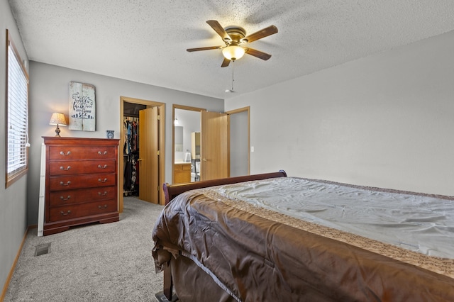 3370 Remington Rd, Rapid City, SD 57703 - bedroom featuring a spacious closet, carpet flooring, a textured ceiling, visible vents, and a closet