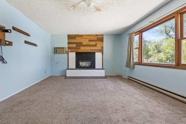 unfurnished living room with a wall mounted AC, a baseboard heating unit, carpet, a textured ceiling, and ceiling fan