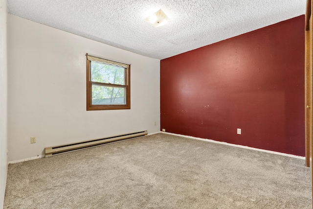 unfurnished room with a baseboard heating unit, carpet flooring, and a textured ceiling
